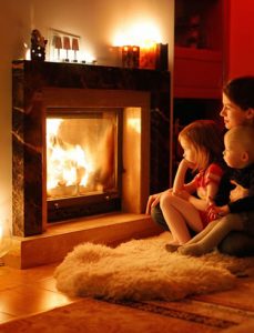 family in front of fireplace
